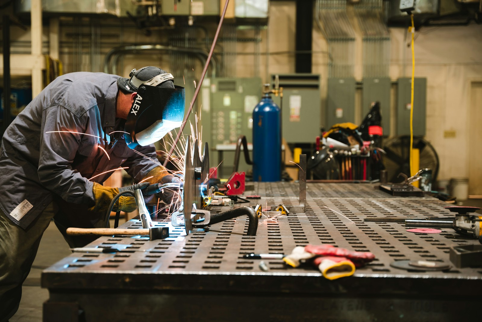 Welder working on industrial metal fabrication